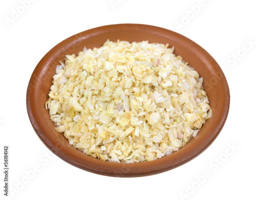 Photo: Dried minced onions in a red clay bowl Dried minced onions in a red clay bowl