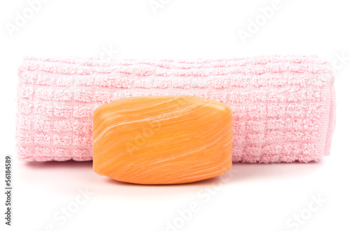 Photo: Pink towel and soap over white Pink towel and soap over white