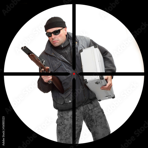 Photo: Dangerous gangster in a police sniper's scope. Dangerous gangster in a police sniper's scope.