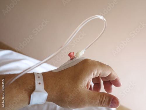 Photo: Patient's hand in the hospital with an IV Patient's hand in the hospital with an IV
