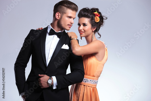 Photo: fashion couple with woman behind man fashion couple with woman behind man
