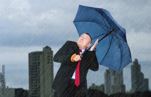Photo: Businessman under the rain Businessman under the rain