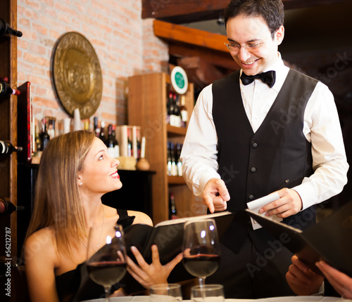 Photo: Waiter suggesting food Waiter suggesting food