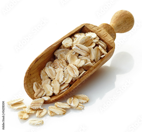 Photo: wooden scoop with oat flakes wooden scoop with oat flakes