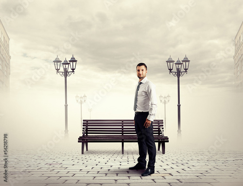 Photo: man standing on the street man standing on the street