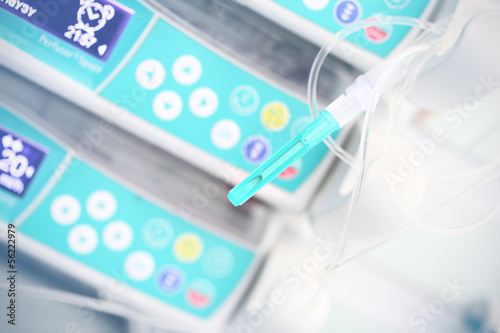 Photo: Medical needle on a background of medical devices Medical needle on a background of medical devices