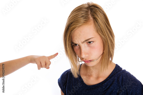Photo: A young girl being bullied A young girl being bullied