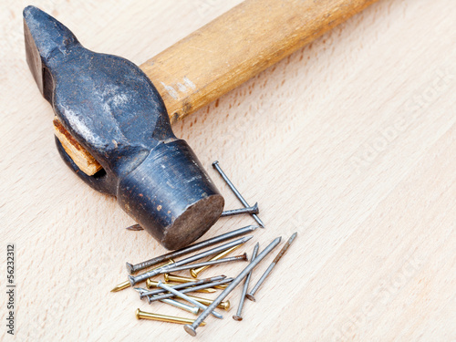Photo: hammer and heap of nails hammer and heap of nails
