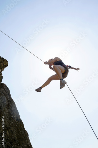 Photo: Female Rock Climber Rappelling Female Rock Climber Rappelling