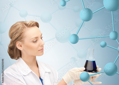 Photo: lab worker holding up test tube lab worker holding up test tube