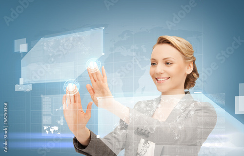 Photo: woman working with virtual screen woman working with virtual screen