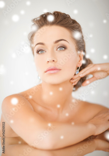 Photo: woman wearing shiny diamond earrings woman wearing shiny diamond earrings