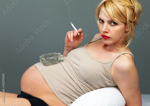 Photo: Pretty pregnant with a cigarette Pretty pregnant with a cigarette