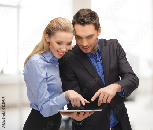 Photo: man and woman with tablet pc man and woman with tablet pc