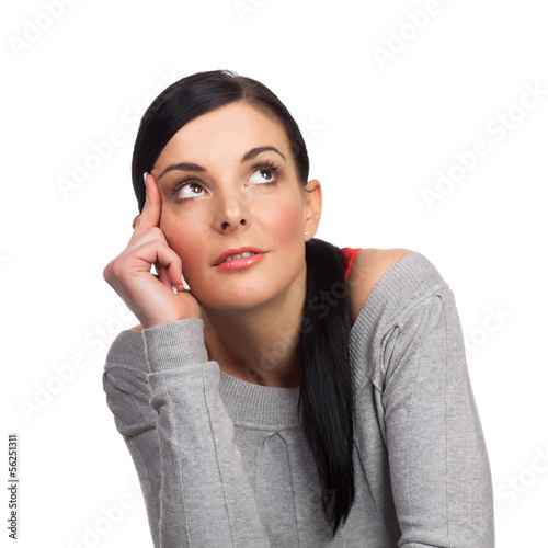 Photo: Happy young woman daydreaming isolated Happy young woman daydreaming isolated