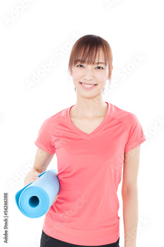 Photo: ヨガマットを持った女性 ヨガマットを持った女性