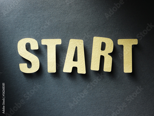 Photo: The word Start on paper background The word Start on paper background