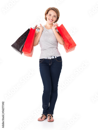 Photo: Happy young woman with shopping bags Happy young woman with shopping bags