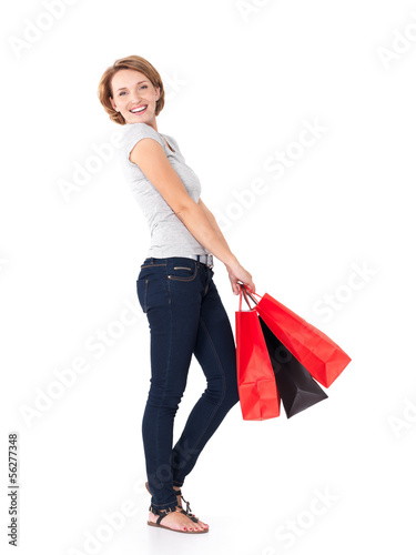 Photo: Happy young woman with shopping bags Happy young woman with shopping bags