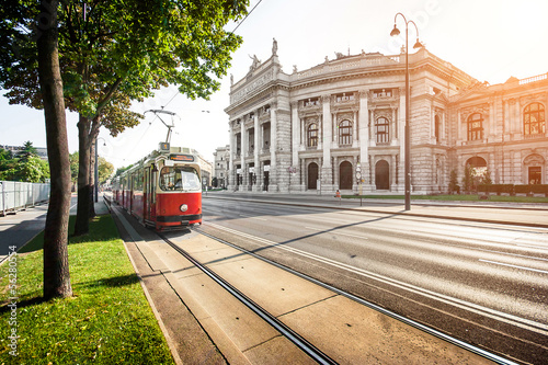 Photo: Famous Ringstrasse with Burgtheater and tram in Vienna, Austria Famous Ringstrasse with Burgtheater and tram in Vienna, Austria