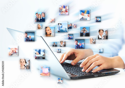 Photo: Hands with laptop computer keyboard. Hands with laptop computer keyboard.