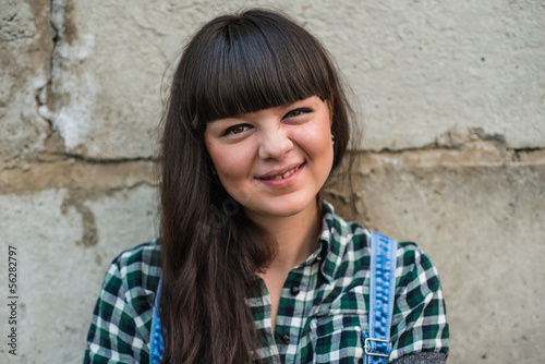 Photo: Pretty young woman pulling funny faces Pretty young woman pulling funny faces