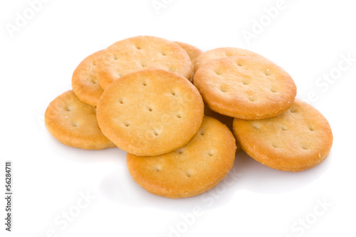 Photo: Small appetizer crackers isolated on white background. Small appetizer crackers isolated on white background.