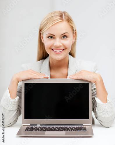 Photo: smiling woman with laptop pc smiling woman with laptop pc