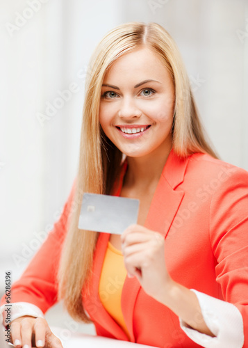 Photo: businesswoman with laptop using credit card businesswoman with laptop using credit card