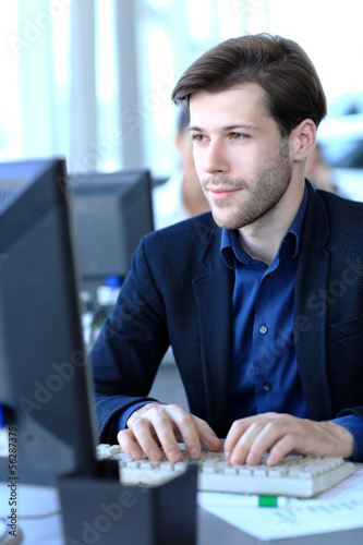 Photo: businessman using laptop businessman using laptop