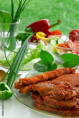 Photo: Barbecue and vegetables. Barbecue and vegetables.