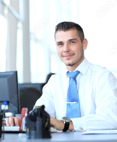 Photo: businessman using laptop businessman using laptop