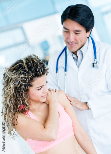 Photo: Gym doctor with a patient Gym doctor with a patient