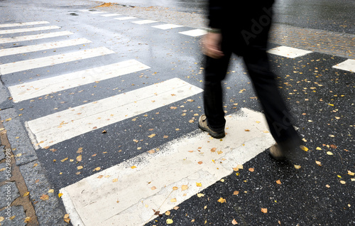 Photo: Man crossing street Man crossing street