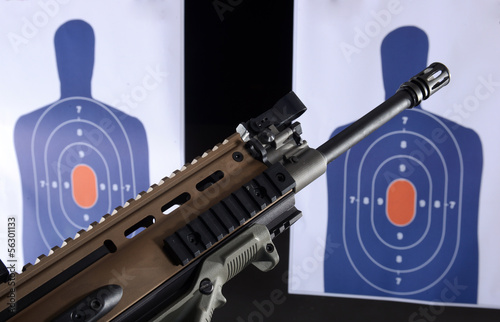 Photo: machine gun and bullseye targets at gun range machine gun and bullseye targets at gun range