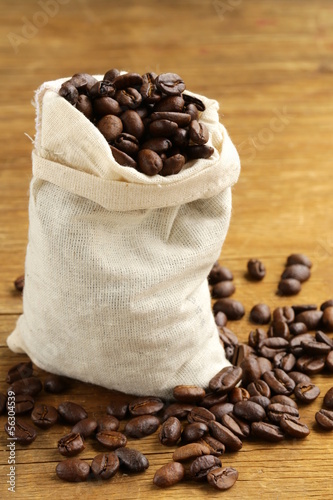 Photo: roasted coffee beans on a wooden table roasted coffee beans on a wooden table