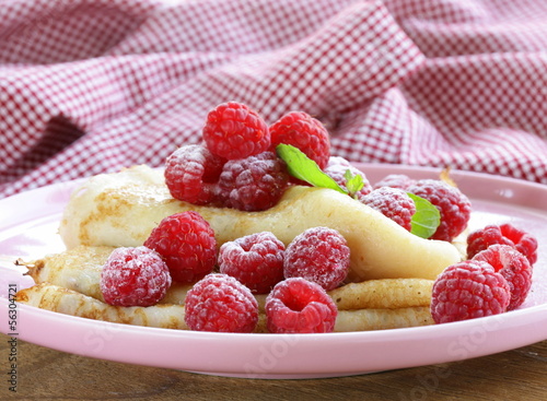 Photo: pancakes (crepes) with raspberries and mint - healthy breakfast pancakes (crepes) with raspberries and mint - healthy breakfast