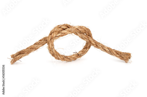 Photo: Rope with knot on white background. Rope with knot on white background.