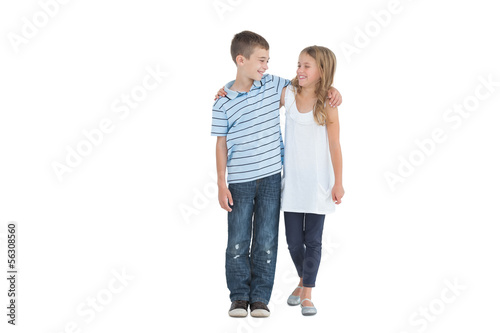 Photo: Smiling young brother and sister holding each other Smiling young brother and sister holding each other