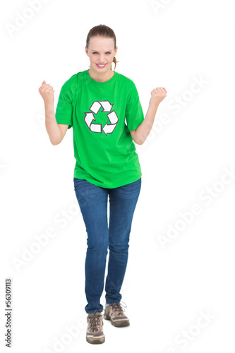 Photo: Successful pretty environmental activist raising her fists Successful pretty environmental activist raising her fists