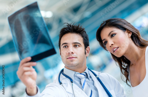 Photo: Doctor looking an x-ray Doctor looking an x-ray