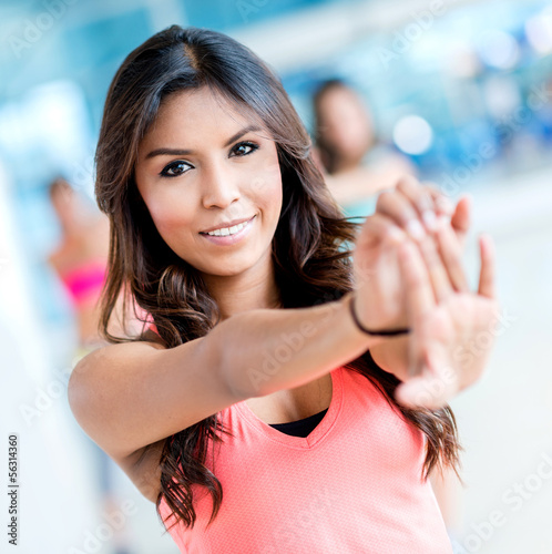 Photo: Woman stretching at the gym Woman stretching at the gym