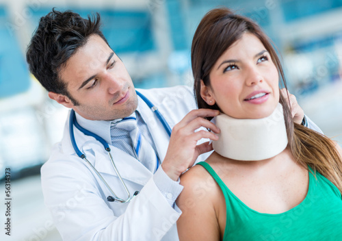 Photo: Woman with a neck injury Woman with a neck injury