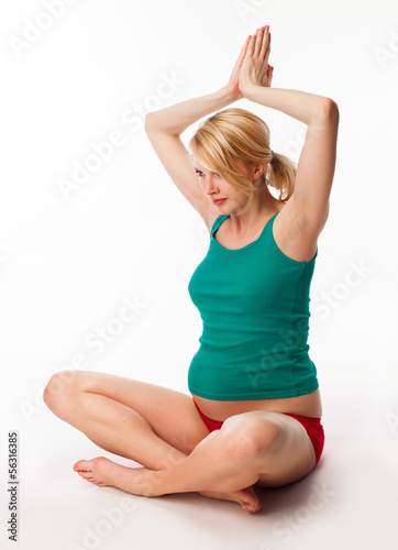 Photo: Pregnant woman doing stretching exercise Pregnant woman doing stretching exercise