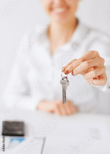 Photo: woman hand holding house keys woman hand holding house keys