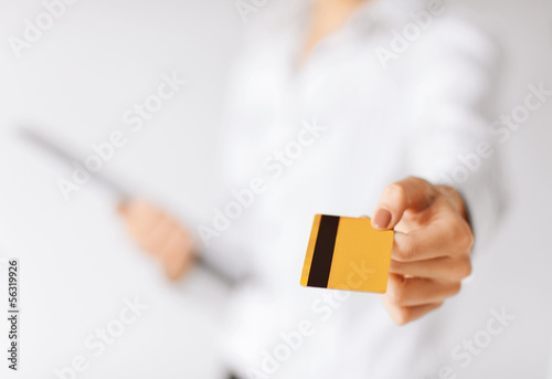 Photo: woman showing gold credit card woman showing gold credit card