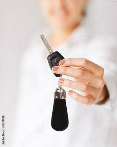 Photo: woman hand holding car key woman hand holding car key
