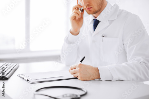 Photo: male doctor with capsules male doctor with capsules