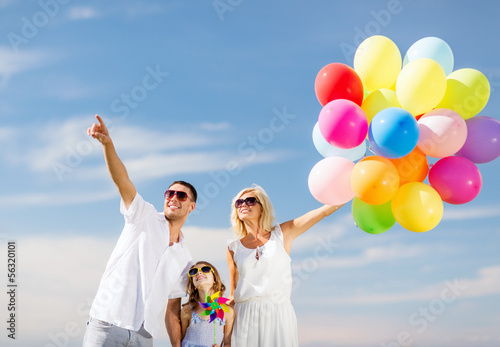 Photo: family with colorful balloons family with colorful balloons