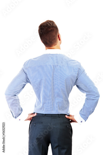 Photo: business man from the back - looking at something over a white b business man from the back - looking at something over a white b